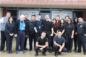 Criminal Justice instructor Leo Becerra and Bobby Evans (center) with members of the Criminal Justice class in 2015 when Becerra received the Acme Teacher of the Month award. Evans nominated Becerra for the award.