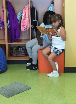 Students at Brookwood Elementary School in Bristol Township share a story in the classroom library during Guided Reading Centers.